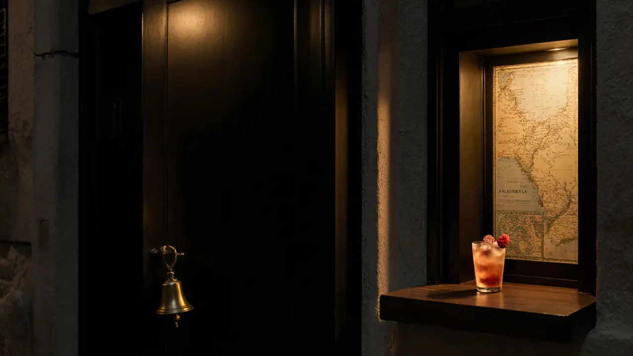 A matte black door with a brass bell in a quiet alley, golden light spilling out at night.